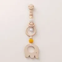 NoniKids Berlin NoniKids Berlin Rasselclip Holz mit *Glocke Elefant* 3 Farben I Bio Baumwollgarn, Gelb/weiss, – Produktbild 1 von 1