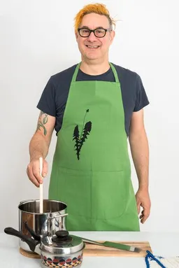 Hirschkind Hirschkind Fair-Trade & Bio-Kochschürze handgewebt grün "Löwenzahn" – Produktbild 1 von 1