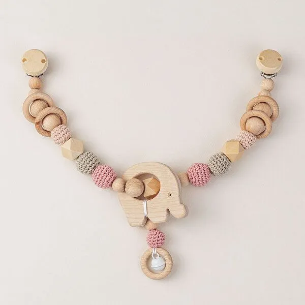 NoniKids Berlin NoniKids Berlin Kinderwagenkette Holz *Elefant Glocke* 2 Farben | Bio Baumwolle, Rosa, – Produktbild 1 von 4