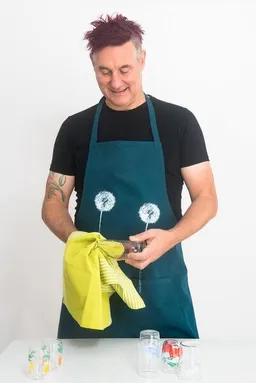 Hirschkind Hirschkind Fair-Trade & Bio-Kochschürze handgewebt petrol "Pusteblumen" – Produktbild 1 von 1