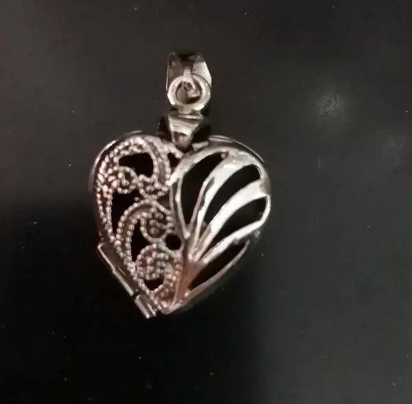 pakilia pakilia Amulett "Corazón Dos Caras" – Produktbild 1 von 1