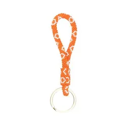 El Puente El Puente Schlüsselanhänger aus Glasperlen in Orange | Fair Trade & Handmade aus Indien – Produktbild 1 von 1