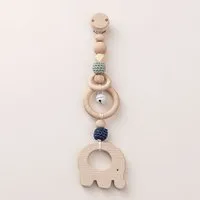 NoniKids Berlin NoniKids Berlin Rasselclip Holz mit *Glocke Elefant* 3 Farben I Bio Baumwollgarn, Mint/blau, – Produktbild 1 von 1